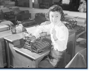Image of woman at a typewriter